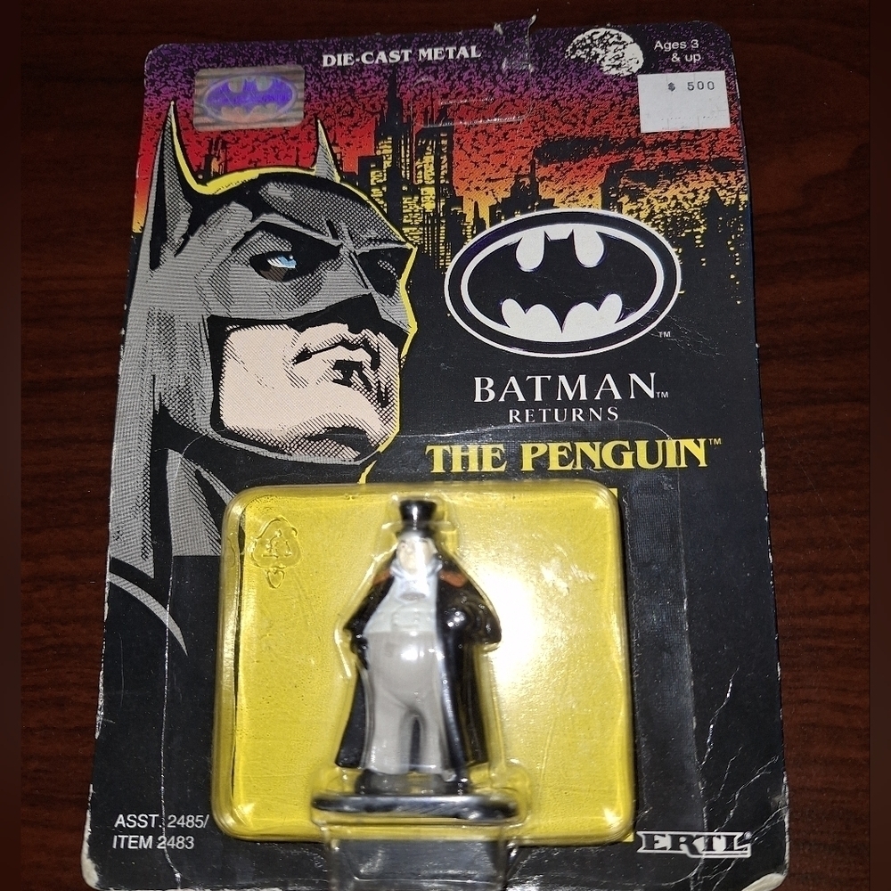 An Ertl Batman Returns "The Penguin" die cast figurine. New in Box.